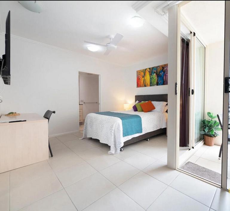 Rúm í herbergi á City Quays Accommodation 2