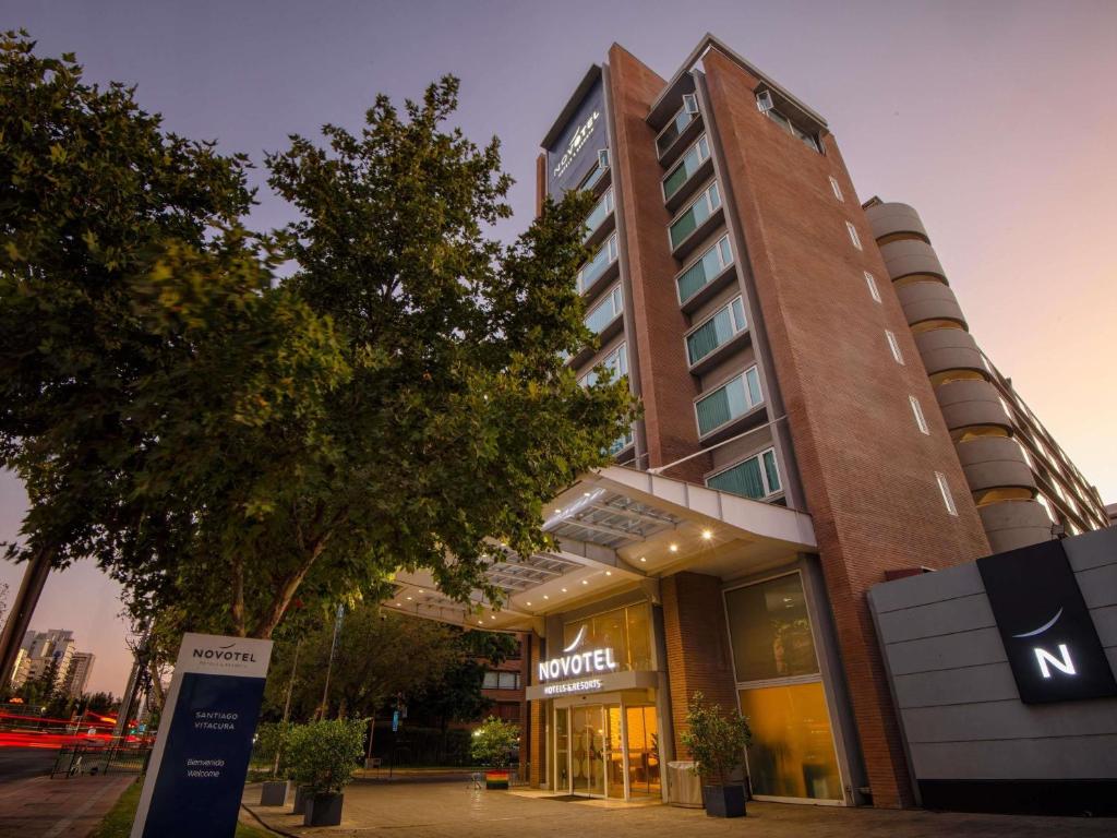a building with a sign in front of it at Novotel Santiago Vitacura in Santiago