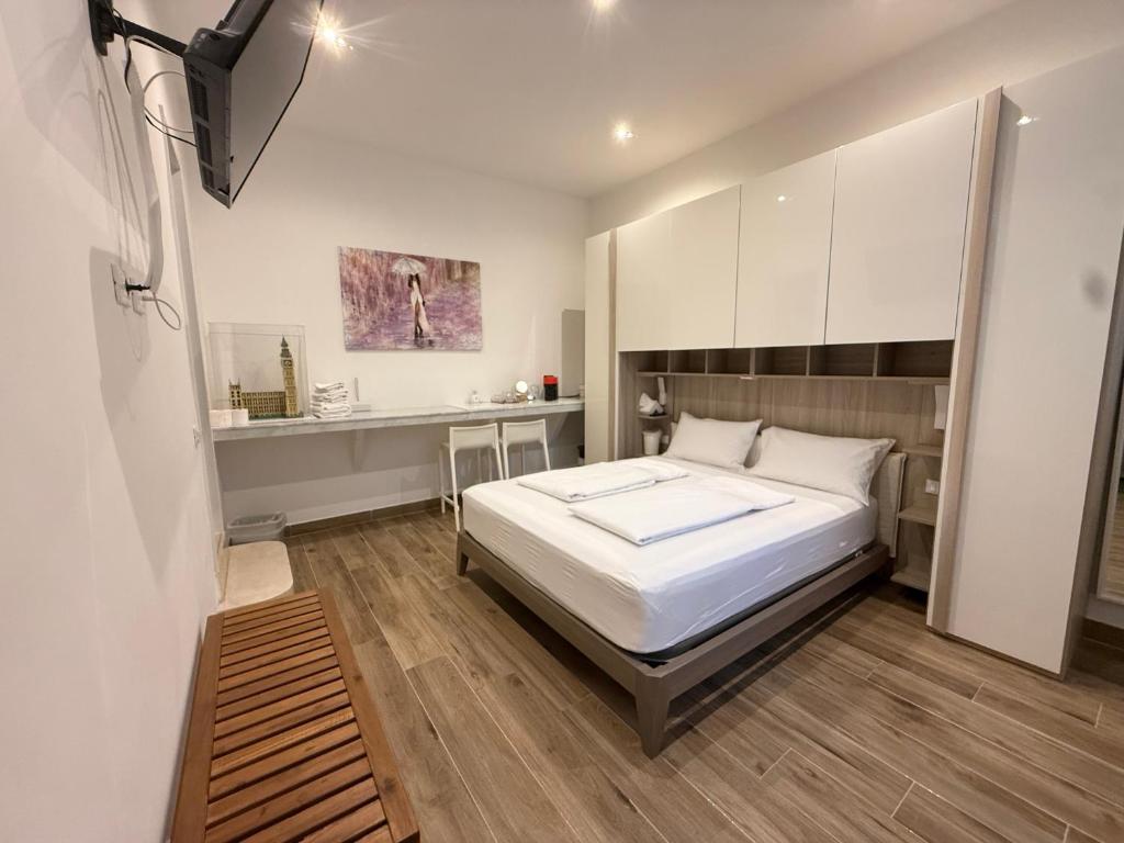 a bedroom with a bed and a desk in it at Apartment Wagner in Milan