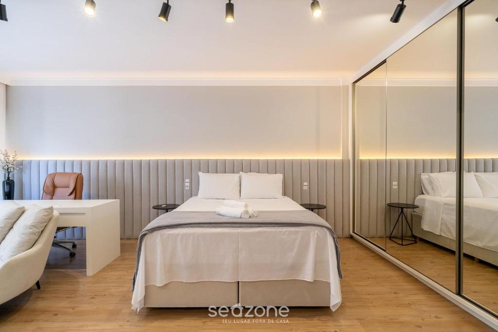 Ένα ή περισσότερα κρεβάτια σε δωμάτιο στο Studio completo a poucos passos da Praia - KPL0806