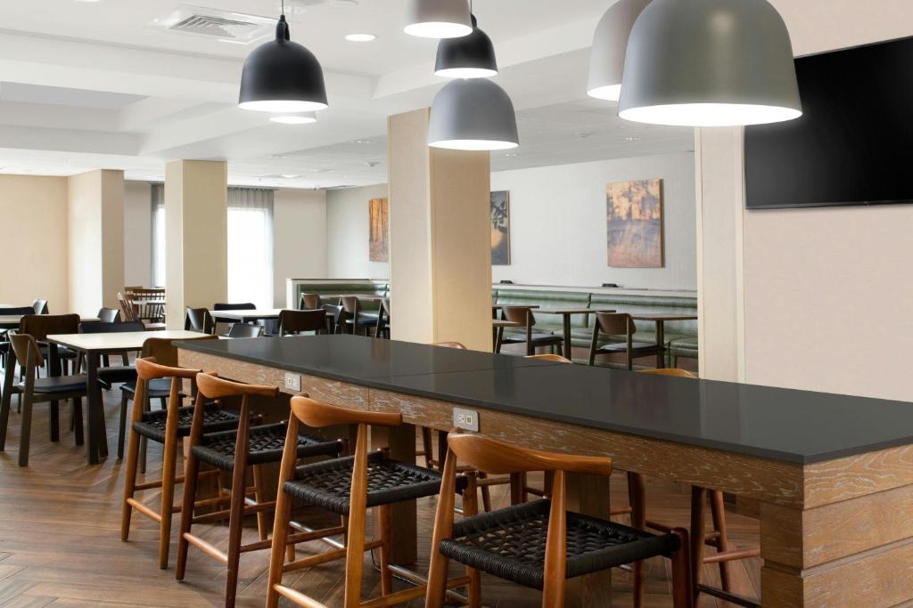 a large dining room with tables and chairs at Fairfield Inn & Suites by Marriott Waco North in Waco