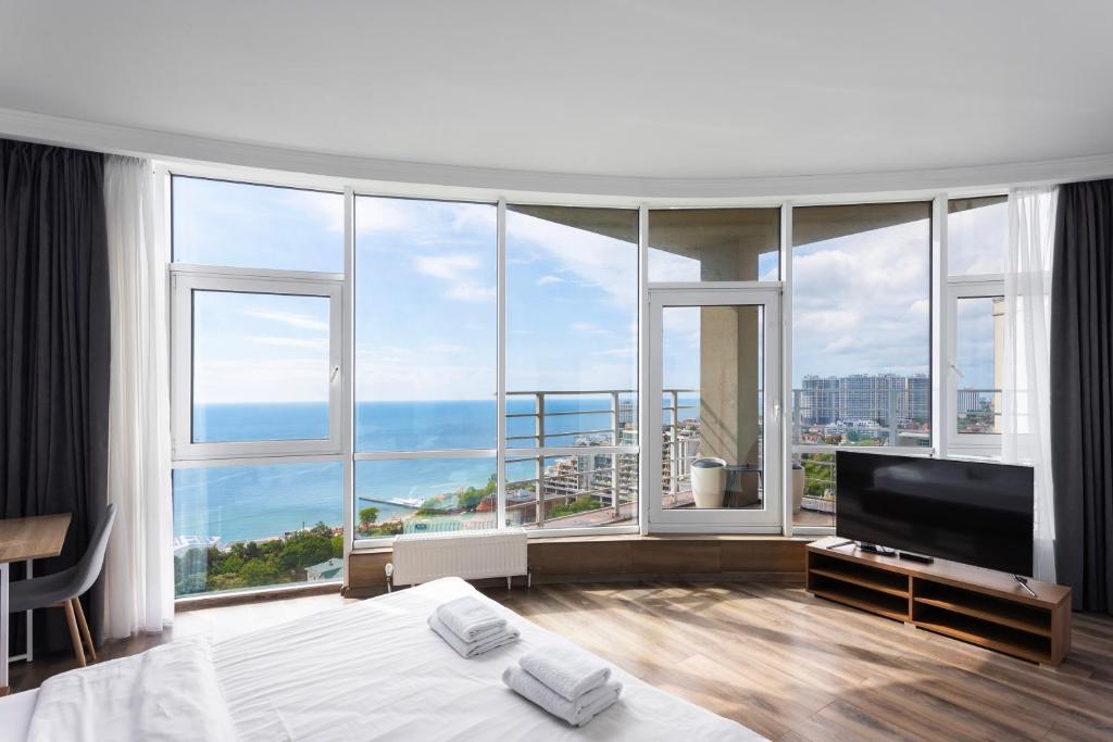 Postel nebo postele na pokoji v ubytování Odesa Pearl Sea