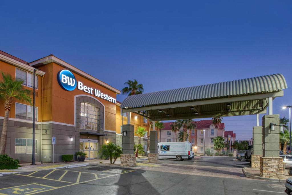 a building with a truck parked at a gas station at Best Western North Phoenix Hotel in Phoenix