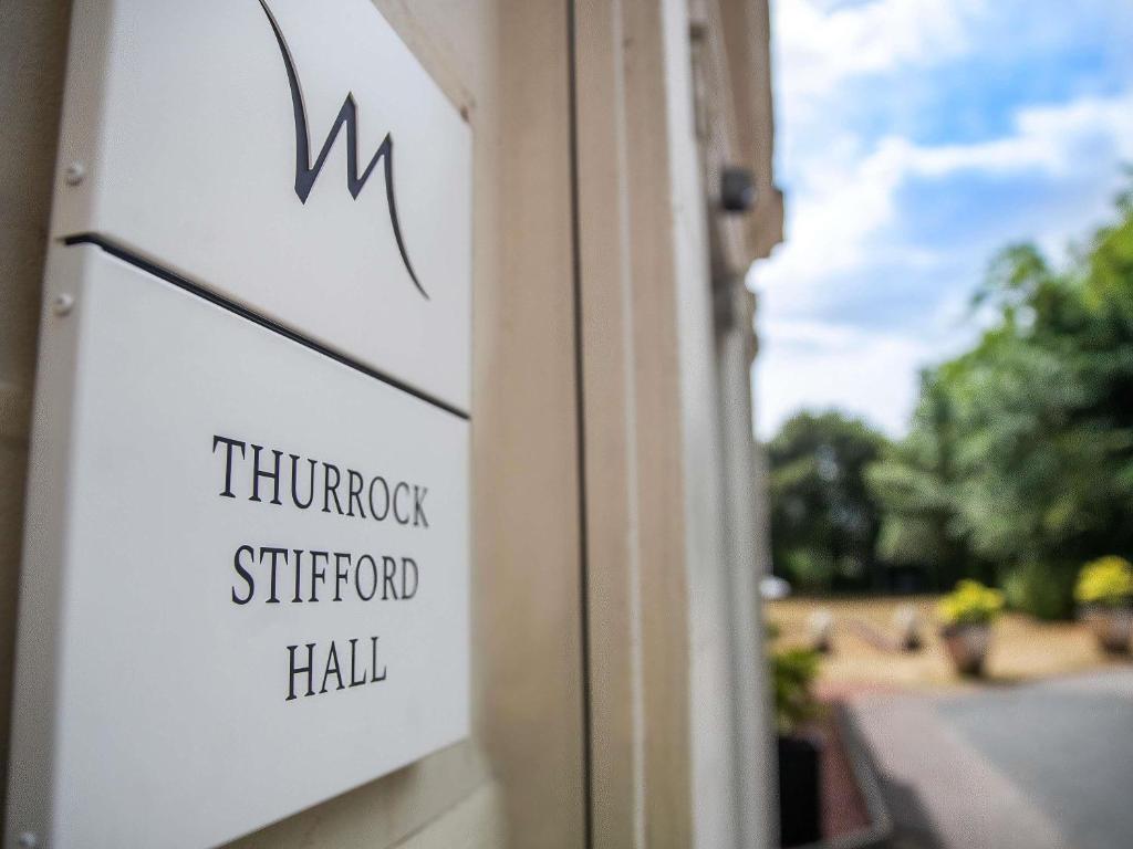 a sign on the side of a building at Mercure Thurrock Stifford Hall in Grays Thurrock