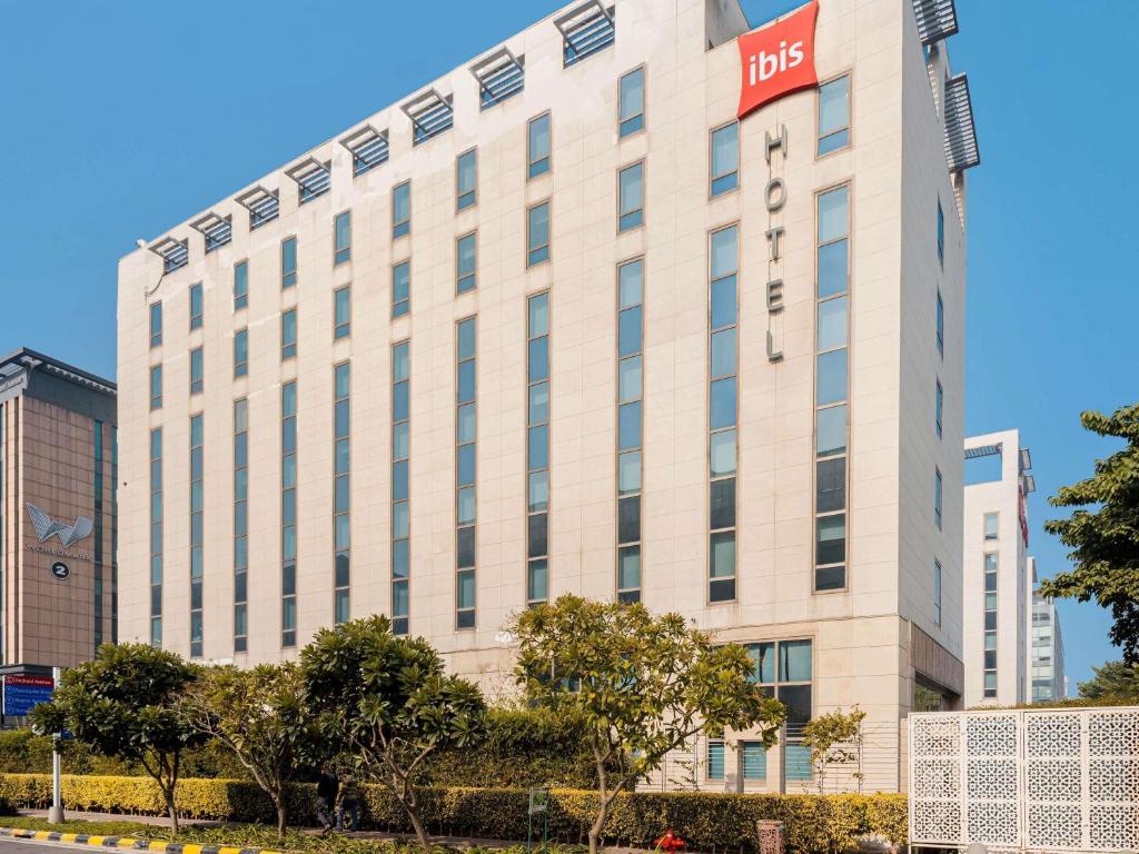 a large white building with a bds sign on it at ibis New Delhi Aerocity - An Accor Brand in New Delhi