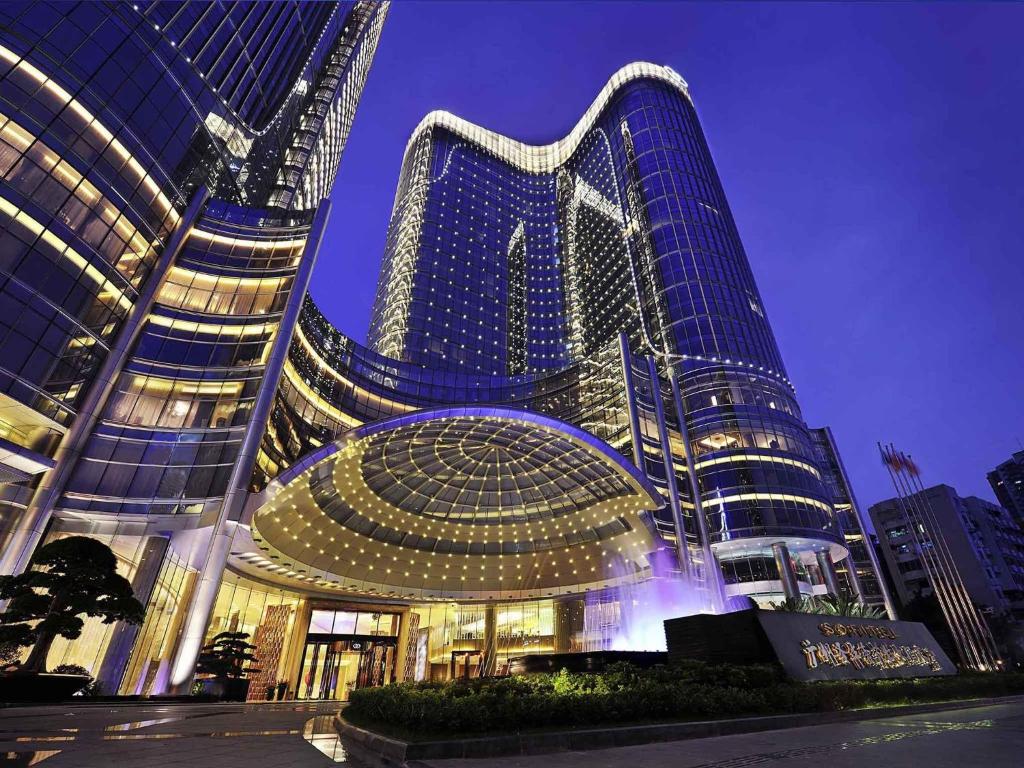 a large building with a lot of lights on it at Sofitel Guangzhou Sunrich - Free Shuttle Bus to Canton Fair Complex & Overseas Buyer Registration Services during Canton Fair Period in Guangzhou