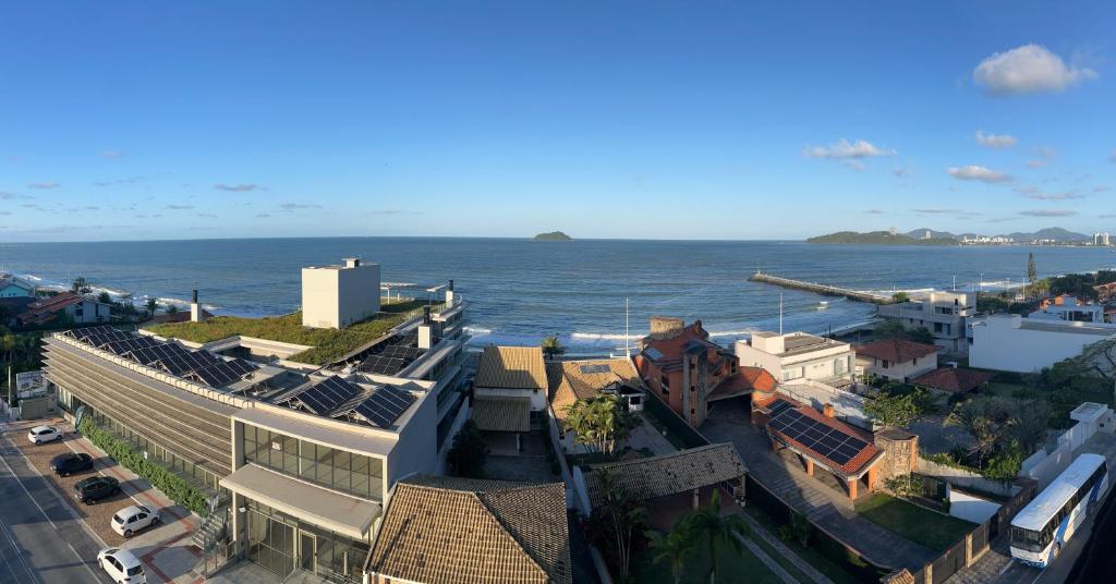 an aerial view of a city and the ocean at Refúgio Vista Mar Balneário Piçarras in Piçarras
