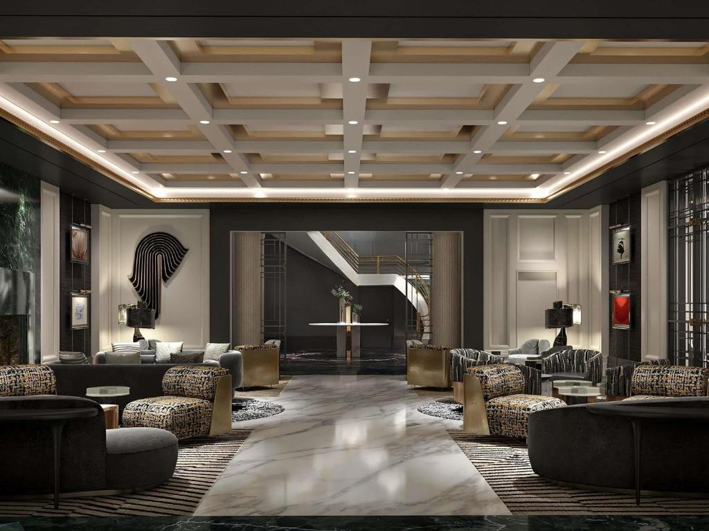 a lobby with couches and chairs in a building at Sofitel New York in New York
