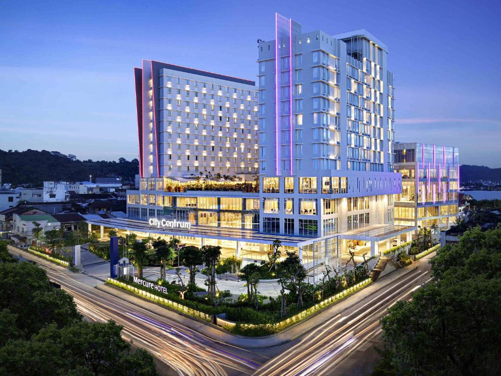 a large building with a street in front of it at Mercure Samarinda in Samarinda