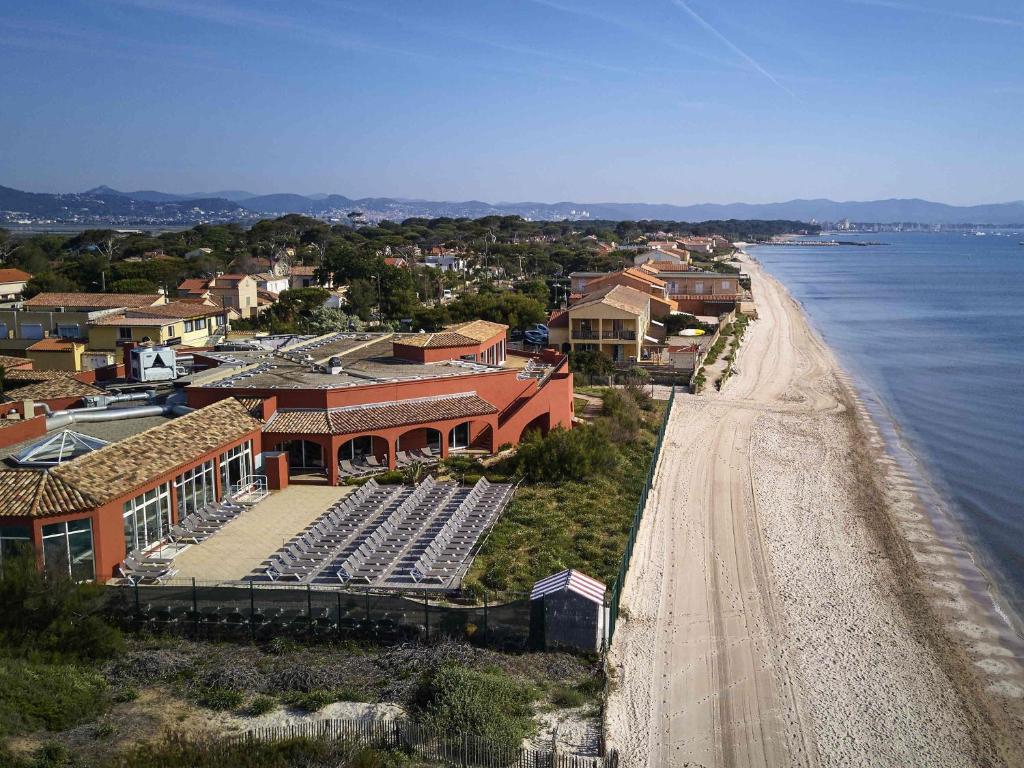 an aerial view of a beach next to the water at ibis Thalassa Hyeres Plage in Hyères