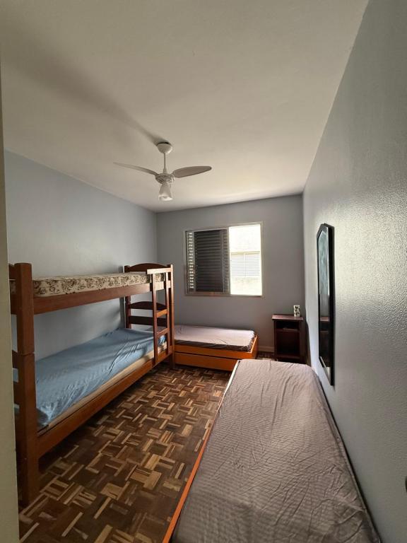 Postel nebo postele na pokoji v ubytování Adriático Guarujá