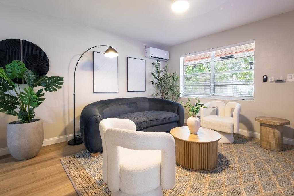 a living room with a couch and chairs at Biva Luxe in West Palm Beach