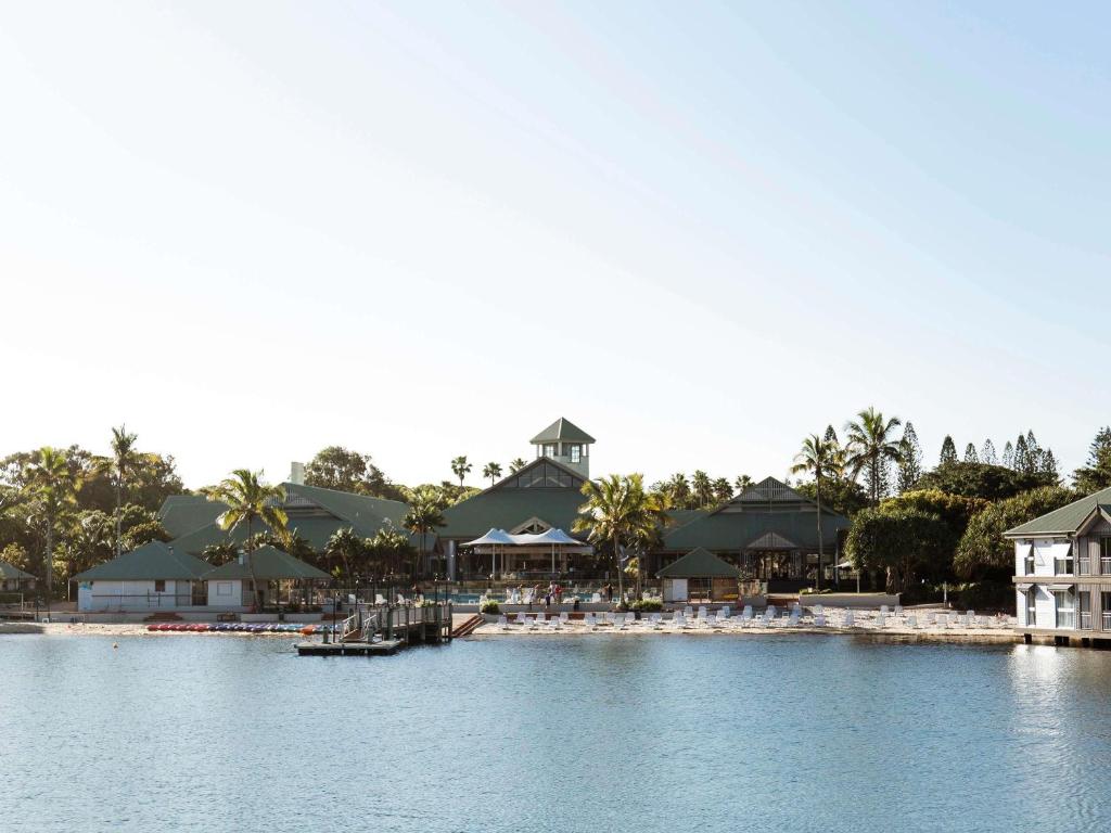 a view of a resort with a body of water at Novotel Sunshine Coast Resort in Twin Waters