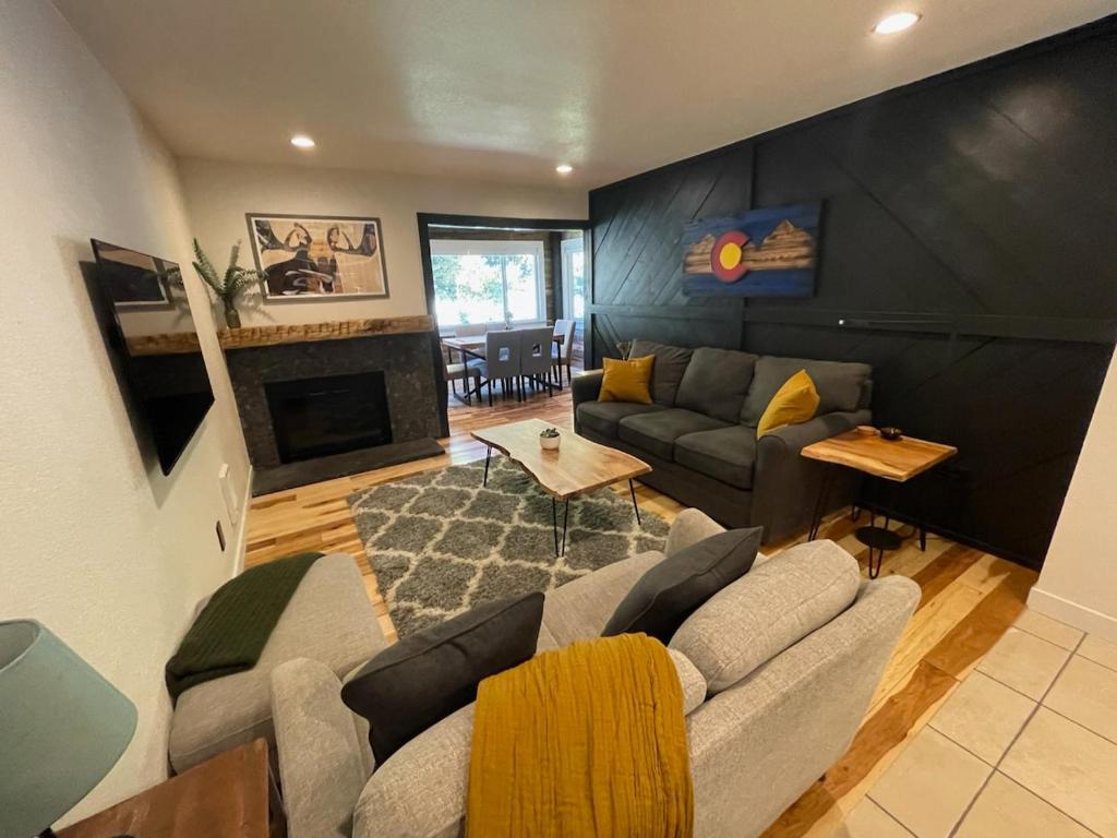 a living room with a couch and a fireplace at Blue Bear - Perfect Mountain Getaway in Idaho Springs