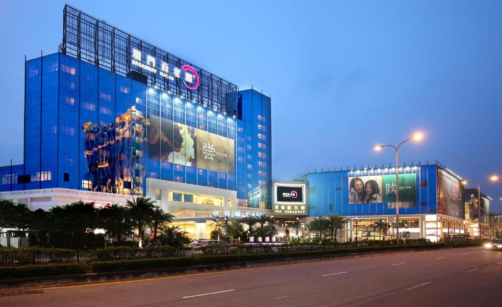 a large blue building with a sign on the side of it at Broadway Hotel in Macau