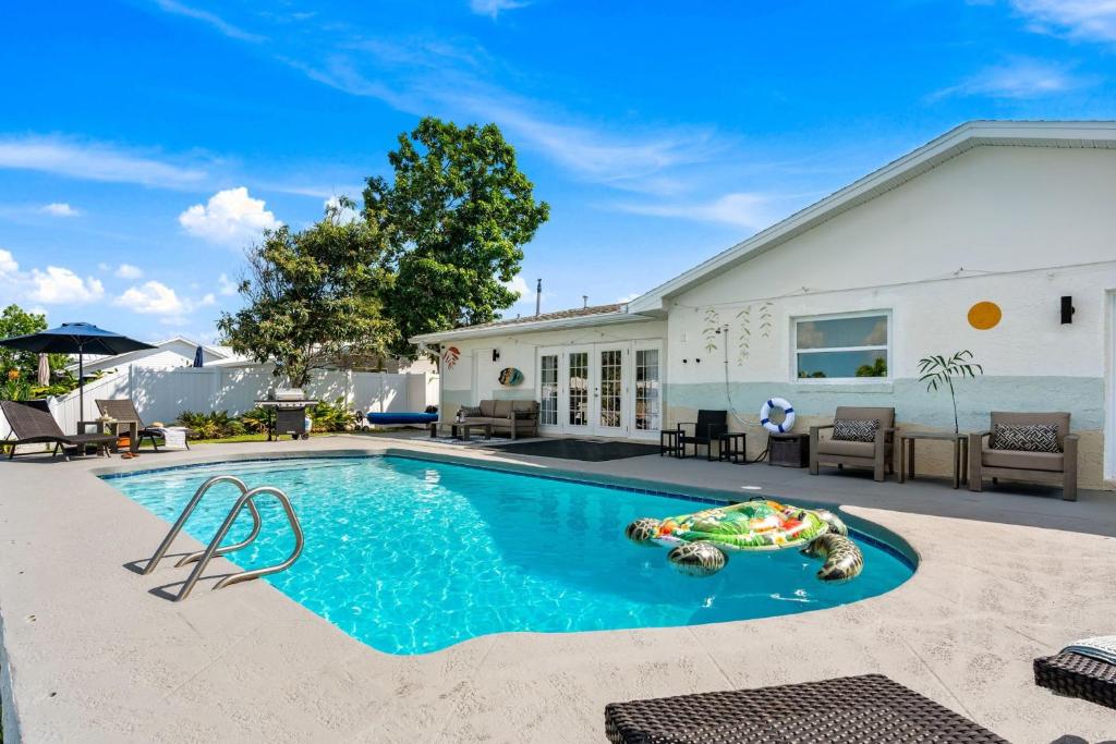 a swimming pool in front of a house at 368 Carmine Dr in Cocoa Beach