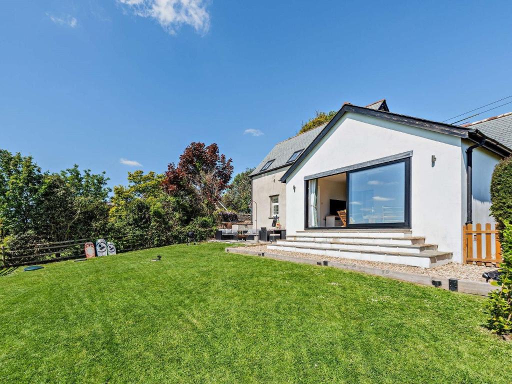 a house with a large window and a yard at 3 Bed in Braunton 53109 in Braunton