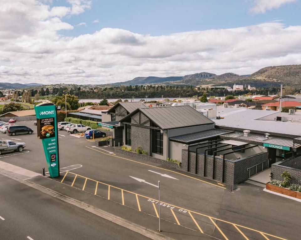 arial view of a parking lot with a building at Claremont Hotel in Claremont