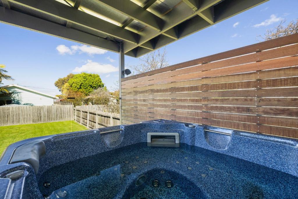 a hot tub in the backyard of a house at Irving House in Cowes