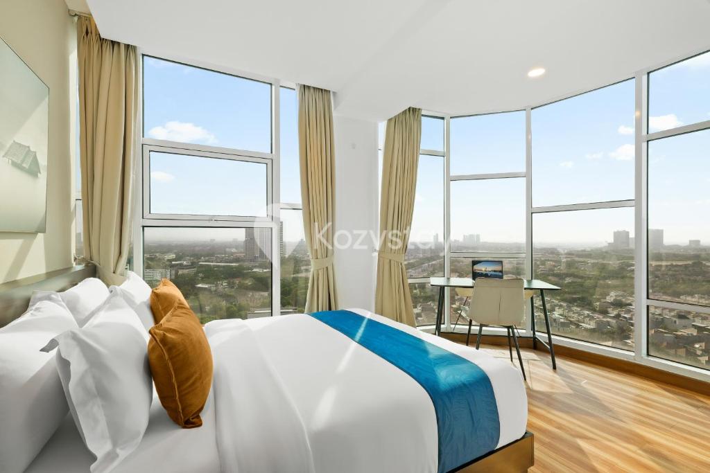 Ένα ή περισσότερα κρεβάτια σε δωμάτιο στο Senvin by Kozystay - Alam Sutera