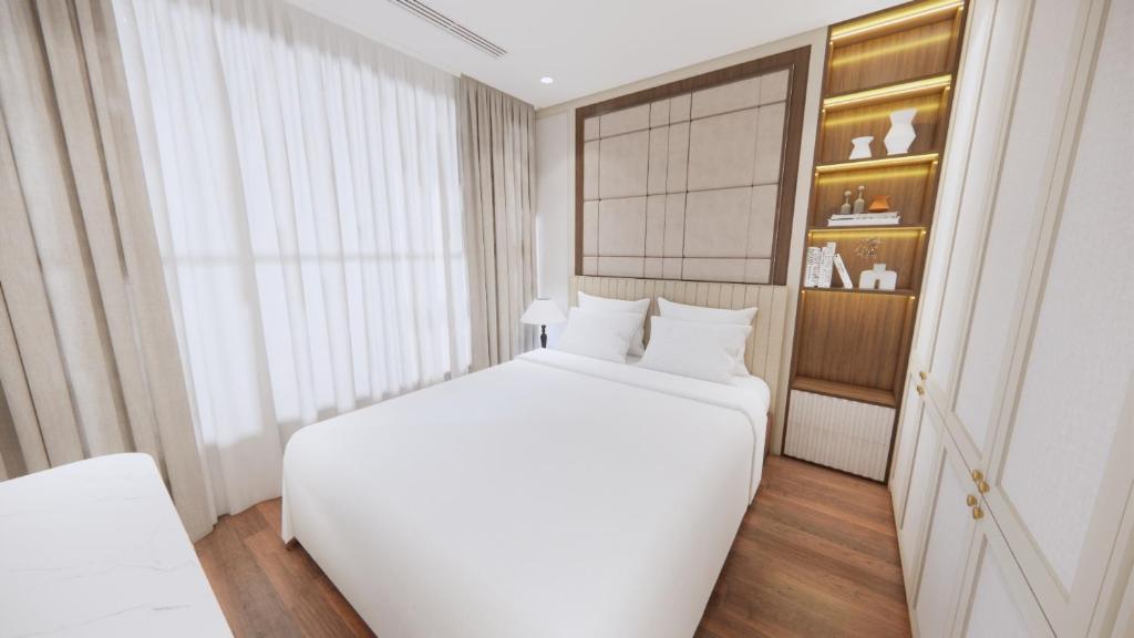 Ένα ή περισσότερα κρεβάτια σε δωμάτιο στο Aravelle Suites