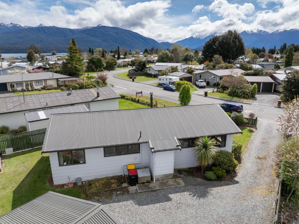 an aerial view of a house in a residential neighbourhood at The Back Hut - Te Anau Holiday Home in Te Anau
