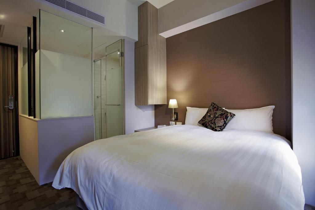 Postel nebo postele na pokoji v ubytování Micasa Hotel