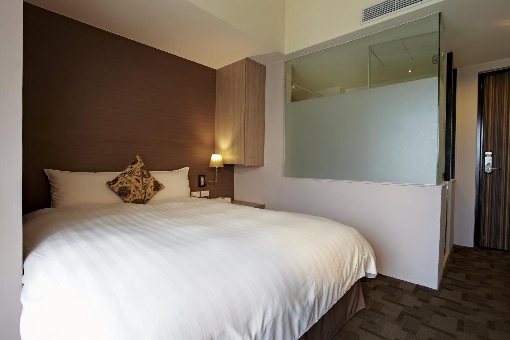 Postel nebo postele na pokoji v ubytování Micasa Hotel