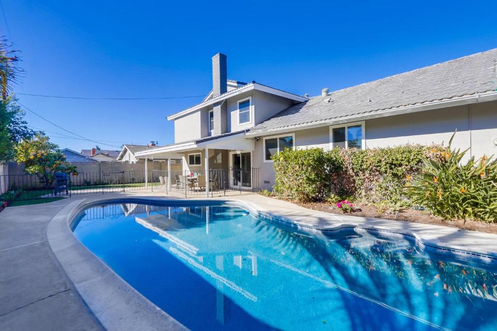 a swimming pool in front of a house at Destination #44 in Orange