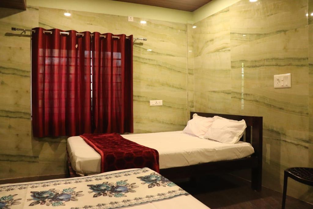 Postel nebo postele na pokoji v ubytování Coastal Plains Gokarna Homestay
