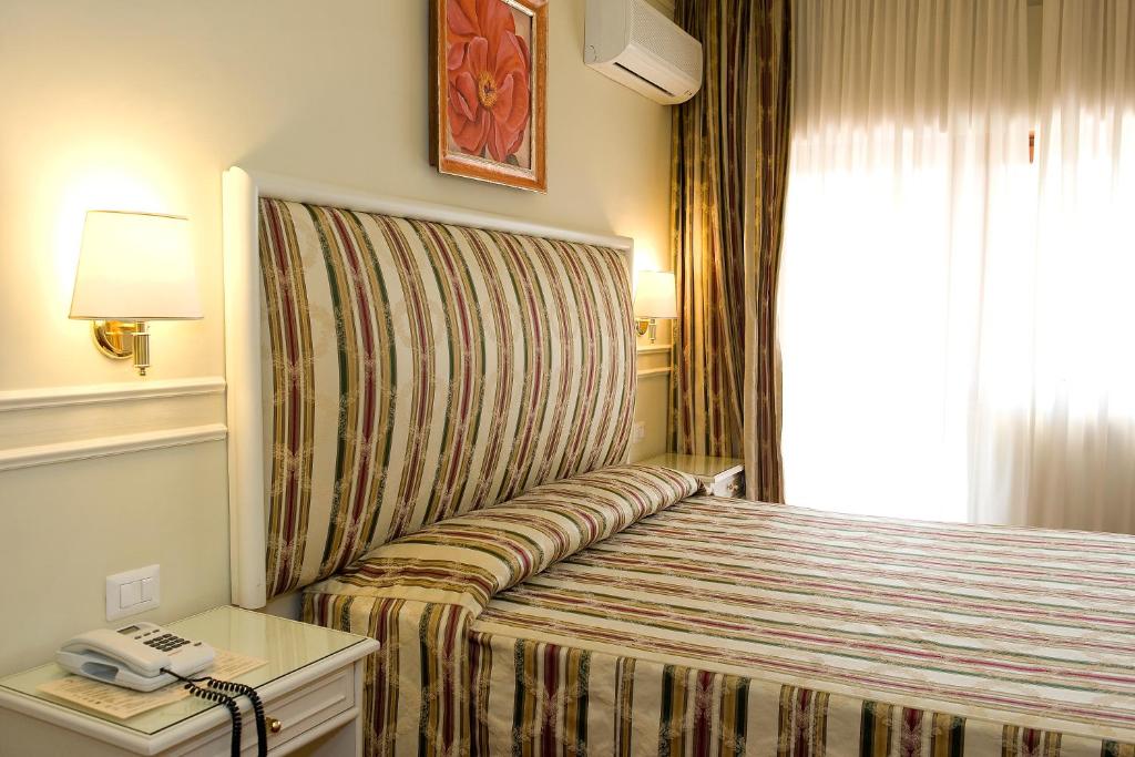 Voodi või voodid majutusasutuse Park Hotel Villaferrata toas