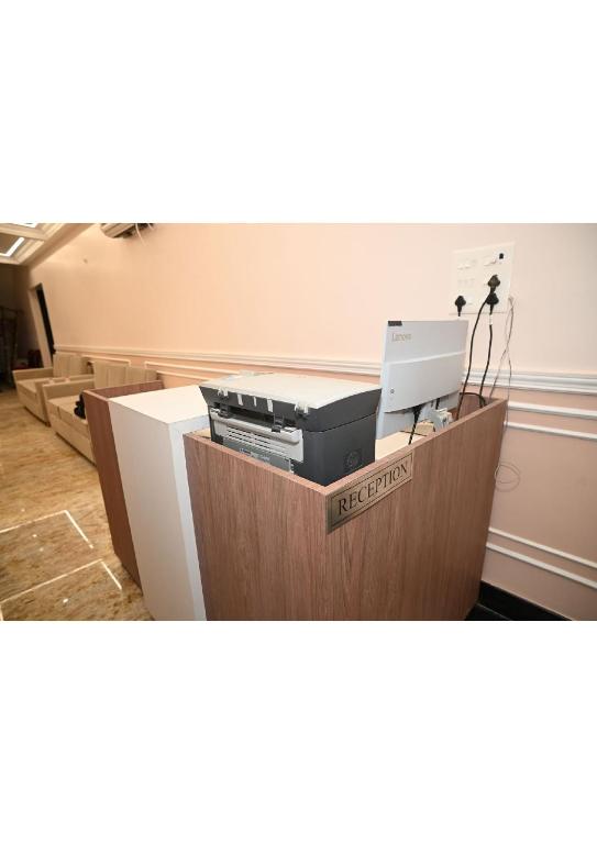 an office with a box with a printer on it at Hotel Nirvvana Residency in Varanasi