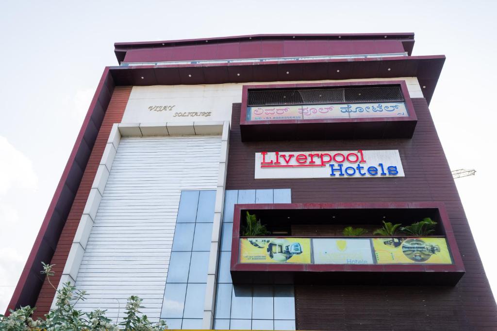 a large building with a hotel sign on it at The Liverpool Hotels Marathahalli, Outer Ring Road in Bengaluru