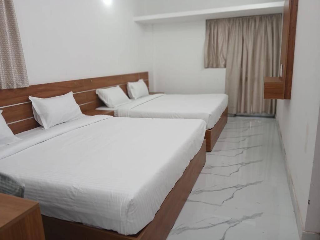 Giường trong phòng chung tại AVSS Cottage Munnar