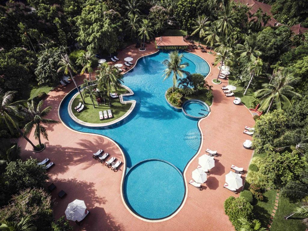 an aerial view of a pool at a resort at Sofitel Angkor Phokeethra Golf & Spa Resort in Siem Reap
