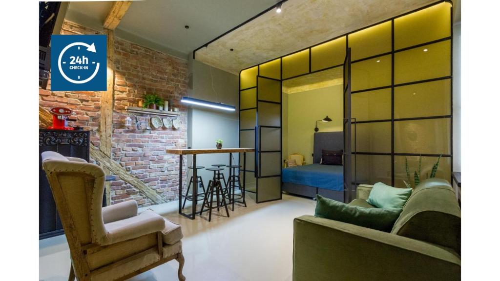 a living room with a couch and a table at Nomad in Cluj-Napoca