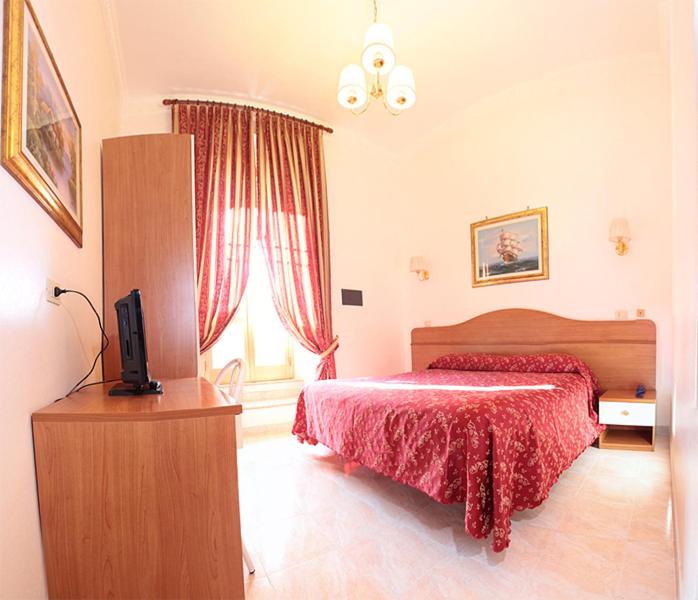 Postel nebo postele na pokoji v ubytování Hotel Euro Quiris