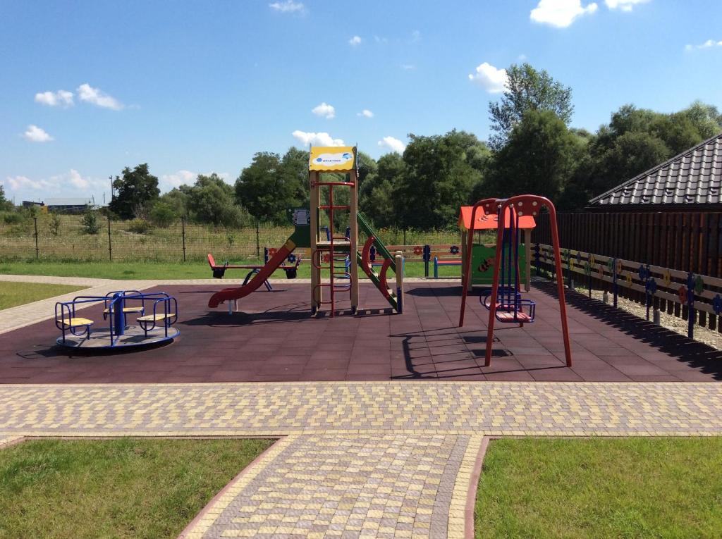 a park with a playground with a slide at Hotel Vulyk in Duliby