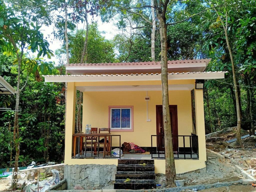 a small house with a porch at Rocky Jungle Bungalows in Koh Rong
