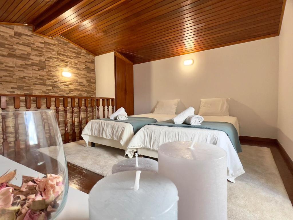 a room with two beds in a room at Countryside Home by Trip2Portugal in Sobral da Abelheira