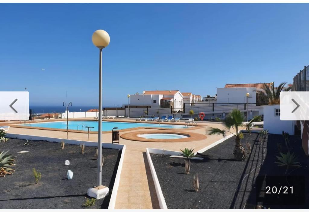 a view of a swimming pool in a resort at Casa vista golf in Caleta De Fuste