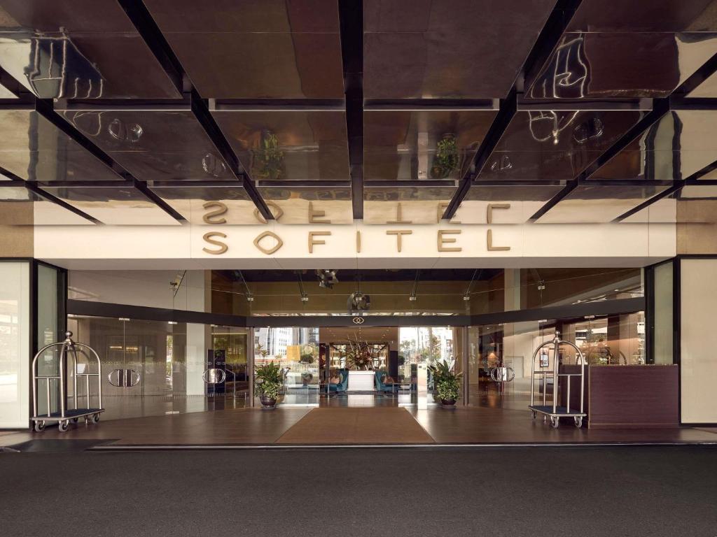 a store front with a sign that reads soited at Sofitel Brisbane Central in Brisbane