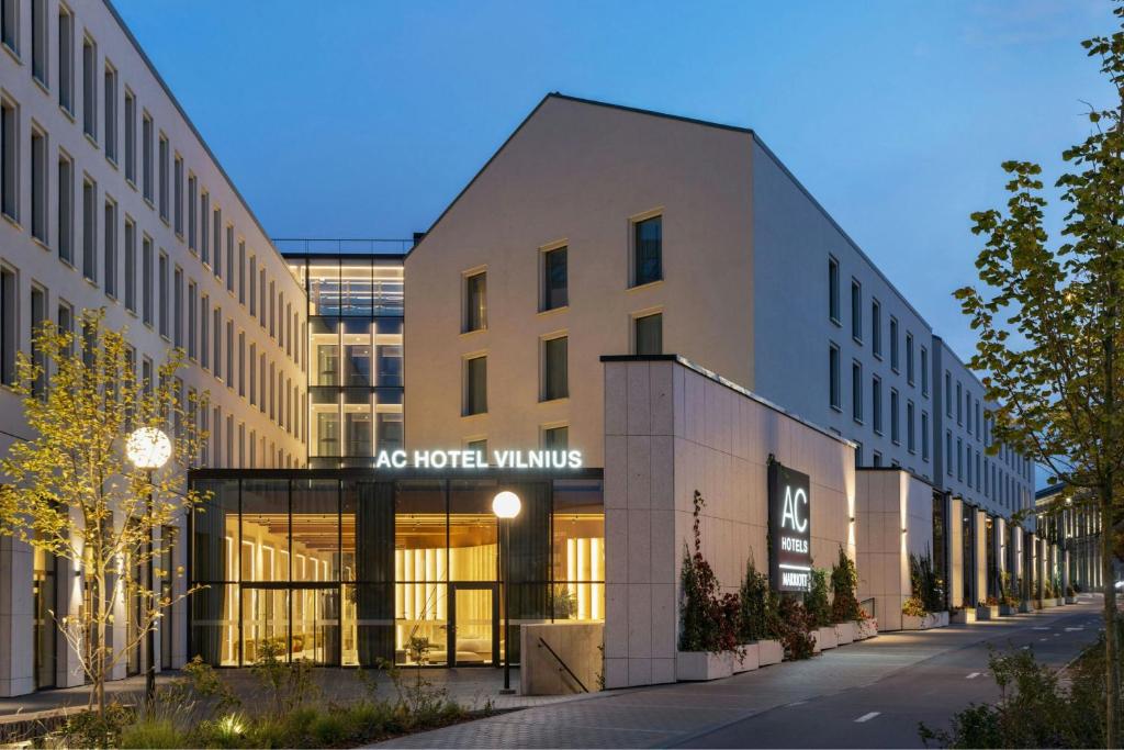 an office building with a sign on the front of it at AC Hotel by Marriott Vilnius in Vilnius