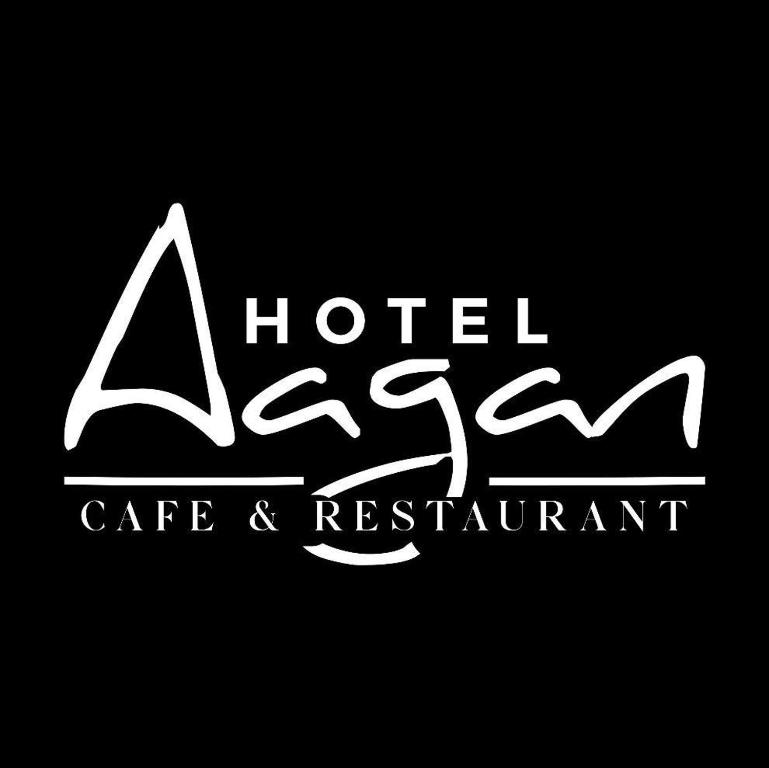 a sign for a hotel care and restaurant at Hotel aagan cafe and resturant in Astam