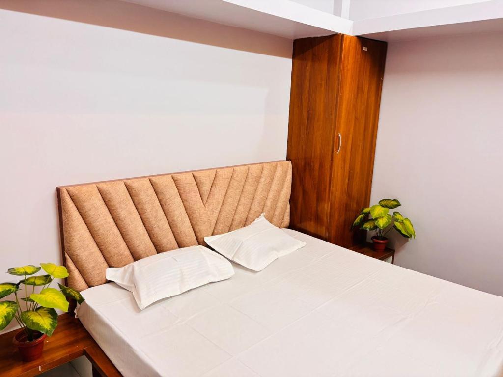 Ένα ή περισσότερα κρεβάτια σε δωμάτιο στο Shree Kala Kunj Guest House