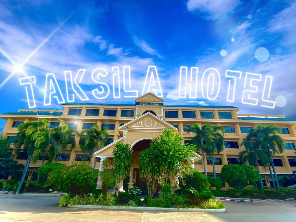 a hotel with a sign that reads take still a hotel at Taksila Hotel in Maha Sarakham