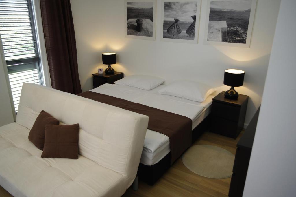Postel nebo postele na pokoji v ubytování Apartments Santis10