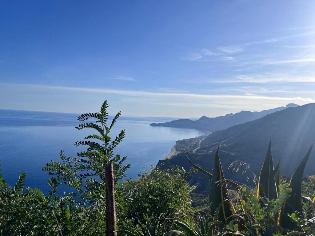 a view of a body of water from a mountain at Due Sorelle in Santa Teresa di Riva