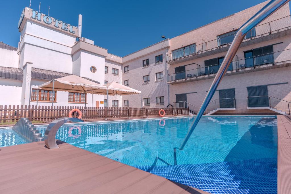 a swimming pool in front of a building at ITC Ciudad de Haro by Soho Boutique in Haro