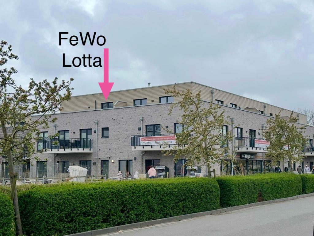 a building with a sign that says fever two luton at Küste33-22 Lotta in Tossenserdeich